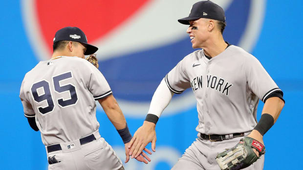 New York Yankees center fielder Aaron Judge (99) celebrates with New York Yankees first baseman Oswaldo Cabrera (95) after winning Game 4 of an American League Division baseball series at Progressive Field, Sunday, Oct. 16, 2022, in Cleveland, Ohio. Alds Game 4 26